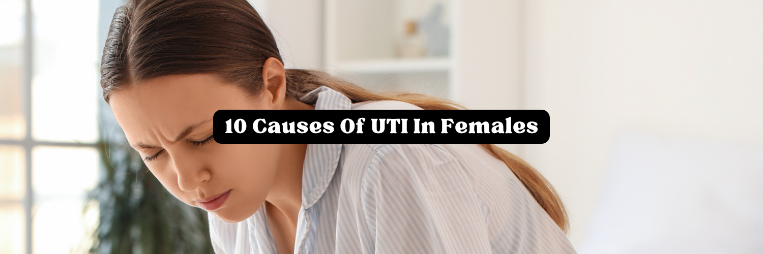 Woman hunched over in pain illustrating 10 causes of UTI in females